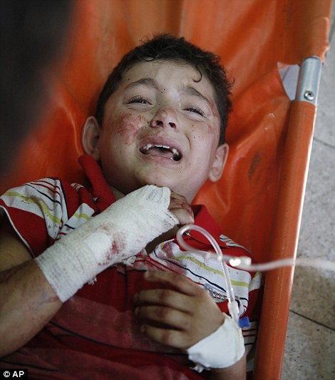 1406213126860_wps_47_A_Palestinian_child_wound.jpg