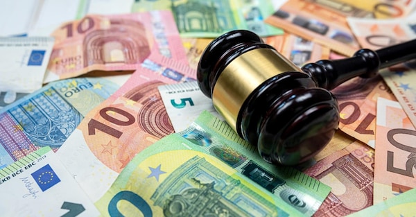 rule of law and auctions with judge's gavel and euro banknotes. Crime concept