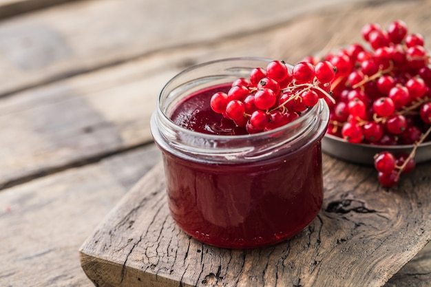 red-juicy-berries-red-currants-jars-berry-jam-wooden-table_154293-7808.jpg