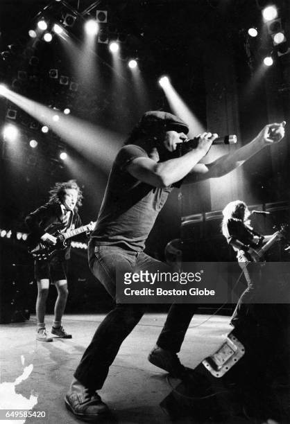 boston-ma-vocalist-brian-johnson-center-leads-a-performance-by-ac-dc-with-guitarist-angus-young.jpg