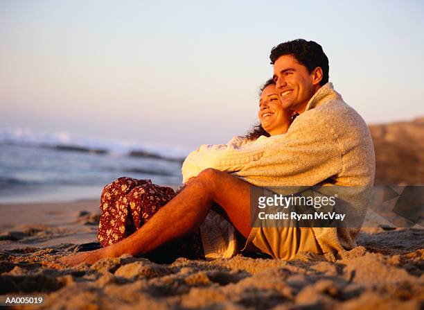 couple-watching-a-sunset-on-the-beach-together.jpg