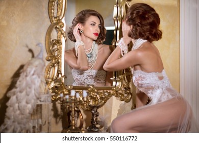 sexy-girl-looks-mirror-260nw-550116772.jpg